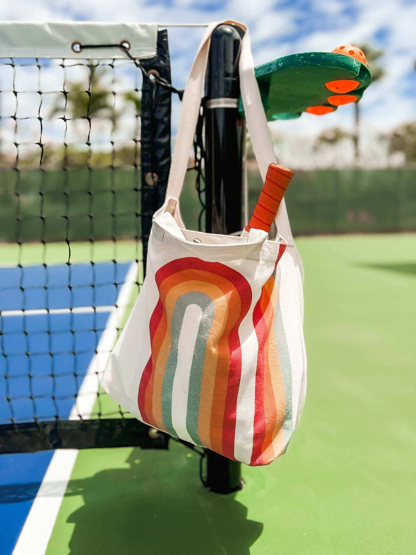 cute rainbow beach bag in canvas, holds 2 pickleball paddles and bags
